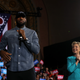 Then-Democratic presidential candidate Hillary Clinton looks on as LeBron James speaks during a campaign rally at the Cleveland Public Auditorium on Nov. 6, 2016.
